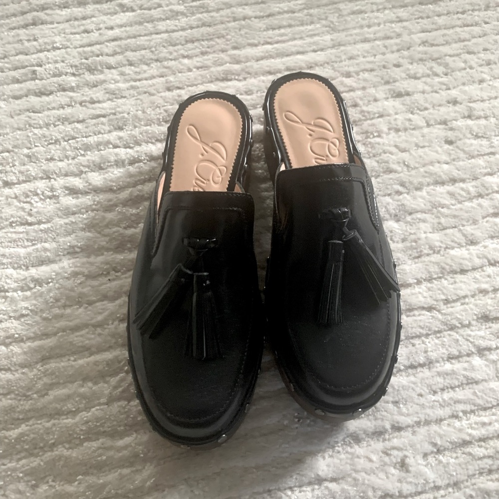 Black J. Crew clogs with tassels